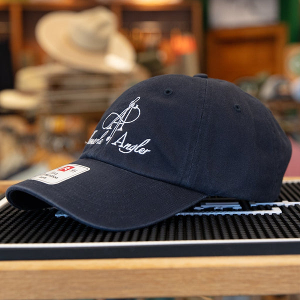 Navy blue cap with logo on a display stand in a store setting
