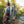 Man fishing by a river with a large backpack on