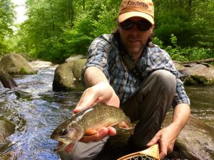 An angler with a nice brook trout