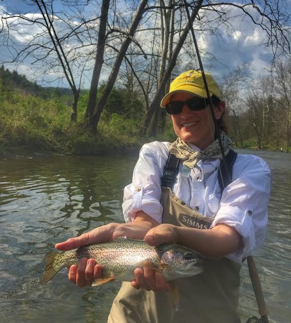 happy angler with a nice rainbow trout.
