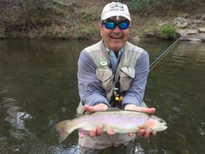 Angler with rainbow trout