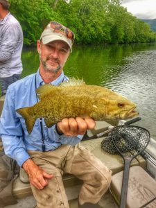 angler with a nice smallmouth bass from the Shenandoah river