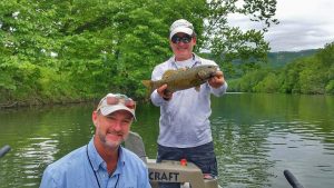 Angler and guide with smallmouth bass on the Shenandoah river