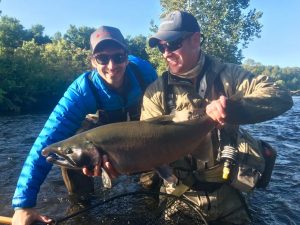 Very happy anglers with a beautiful Coho/Silver salmon caught while fishing the Salmon River in New York. Salmon river, Pulaski New York.