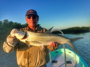 A small tarpon caught while fishing from the Long Caye outpost and Belize River Lodge, Belize.