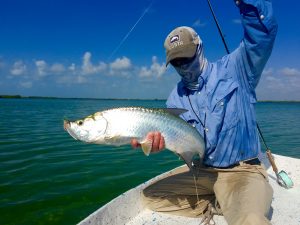 Angler with baby tarpon from Ascension Bay Mexico. Casa Blanca Lodge.