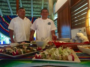 Staff servining food at Casa Blanca Lodge, Ascension bay, Mexico