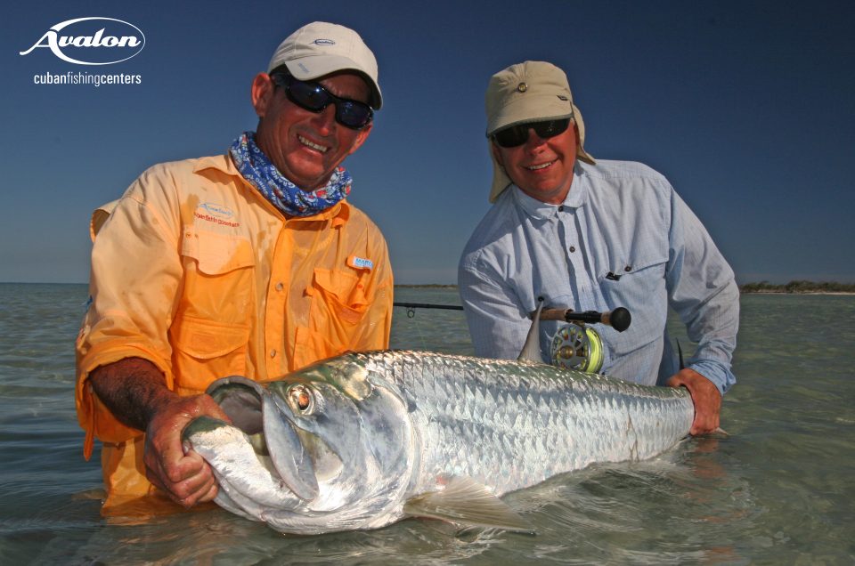 Cuba/Avalon. Angler and guide holding a tarpon caught while fishing in Cuba.