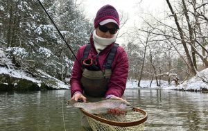 A beautiful rainbow trout caught while winter fishing in Virginia with an Charlottesville Va, fishing guide.