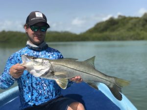 a happy angler with a nice snook caught while fishing with La Pescadora Lodge.