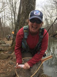 Very happy angler with her first trout cuaght on the Moormans River Virginia. Ladies fly fishing classes. 