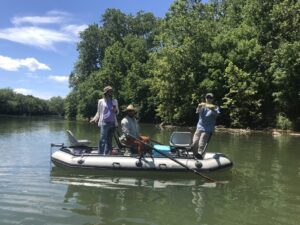 Three anglers fishing from a SmithFly Big Shoals.